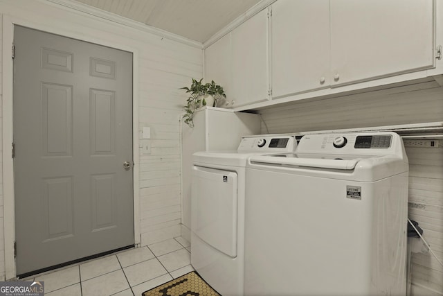 684 Frances Ln, Brooklet, GA 30415 - laundry area featuring washer and clothes dryer, cabinet space, light tile patterned floors, and ornamental molding