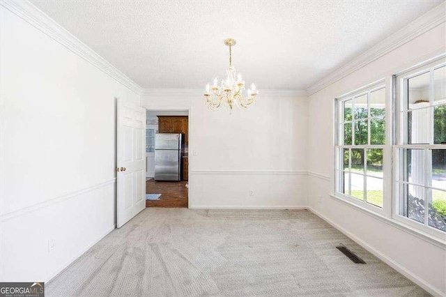 204 Old Oak Rd, Macon, GA 31216 - carpeted spare room with a chandelier, plenty of natural light, a textured ceiling, and ornamental molding