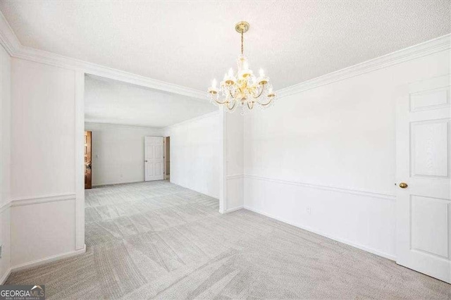 204 Old Oak Rd, Macon, GA 31216 - unfurnished room with carpet flooring, a chandelier, and ornamental molding
