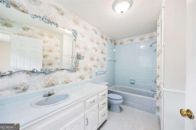 204 Old Oak Rd, Macon, GA 31216 - bathroom with wallpapered walls, vanity, bathing tub / shower combination, and a textured ceiling