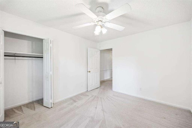 204 Old Oak Rd, Macon, GA 31216 - unfurnished bedroom with carpet flooring, a textured ceiling, a closet, and ceiling fan