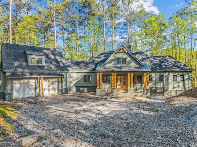 1281 Snug Harbor Dr, Greensboro, GA 30642 - view of front of house with a porch, driveway, board and batten siding, and a shingled roof