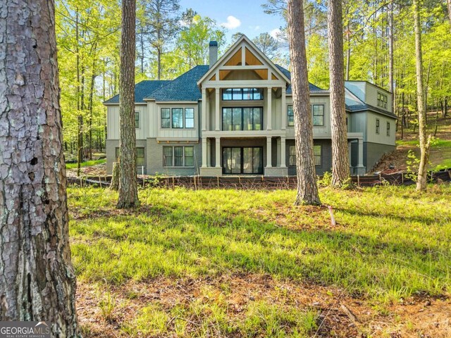 1281 Snug Harbor Dr, Greensboro, GA 30642 - back of house with a chimney and roof with shingles