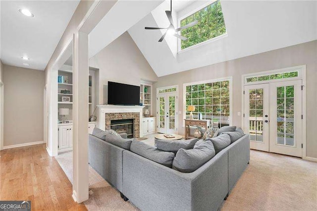 501 Avery Creek Pointe, Woodstock, GA 30188 - living area with french doors, a ceiling fan, built in shelves, high vaulted ceiling, and recessed lighting