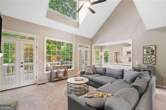 501 Avery Creek Pointe, Woodstock, GA 30188 - living room featuring french doors, high vaulted ceiling, light colored carpet, and ceiling fan