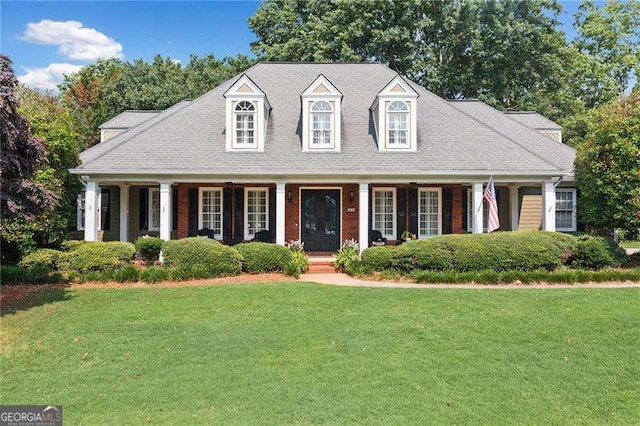 501 Avery Creek Pointe, Woodstock, GA 30188 - cape cod home featuring covered porch and a front yard