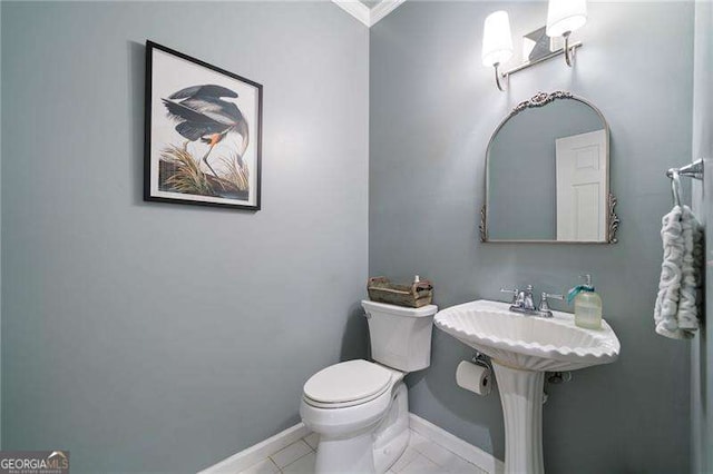 501 Avery Creek Pointe, Woodstock, GA 30188 - half bathroom featuring crown molding and tile patterned flooring
