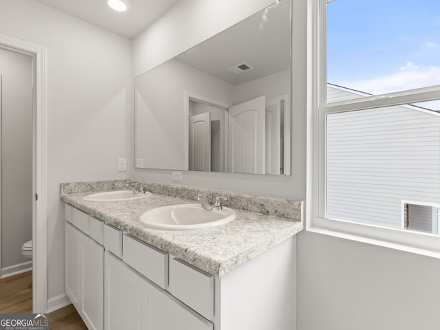 504 Oak View Ln, Dallas, GA 30157 - full bathroom with double vanity, wood finished floors, and recessed lighting