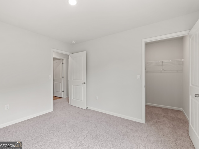 504 Oak View Ln, Dallas, GA 30157 - unfurnished bedroom with carpet flooring, a spacious closet, and a closet