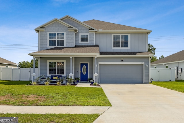 159 College St, Kingsland, GA 31548 - view of front of property with a gate, a porch, an attached garage, driveway, and board and batten siding