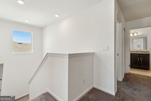 159 College St, Kingsland, GA 31548 - hallway with light carpet, an upstairs landing, and recessed lighting