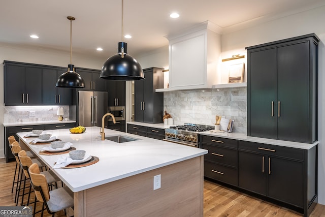 2164 James Aly, Atlanta, GA 30345 - kitchen with stainless steel appliances, a breakfast bar, crown molding, light wood finished floors, and hanging light fixtures