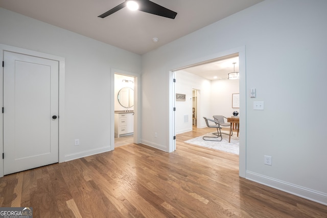 2164 James Aly, Atlanta, GA 30345 - unfurnished bedroom with wood finished floors, connected bathroom, and a ceiling fan