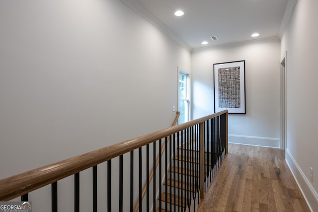 2164 James Aly, Atlanta, GA 30345 - hall featuring an upstairs landing, crown molding, wood finished floors, and recessed lighting