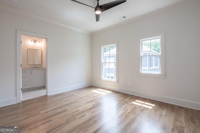 2164 James Aly, Atlanta, GA 30345 - unfurnished bedroom featuring light wood finished floors, ornamental molding, ensuite bath, and ceiling fan