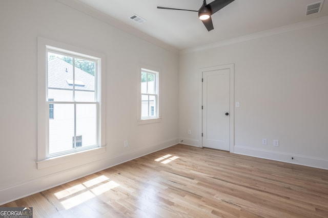 2164 James Aly, Atlanta, GA 30345 - spare room featuring ceiling fan, light wood-style floors, and ornamental molding
