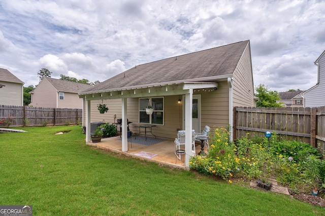 410 Meadowbend Cir, Athens, GA 30606 - back of house with a fenced backyard, a patio, and a shingled roof