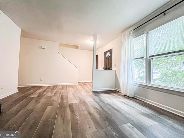 3150 Stratford Green Pl, Avondale Estates, GA 30002 - unfurnished living room with wood finished floors and baseboards