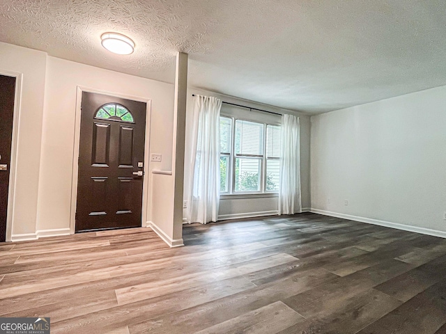 3150 Stratford Green Pl, Avondale Estates, GA 30002 - entryway featuring wood finished floors and a textured ceiling