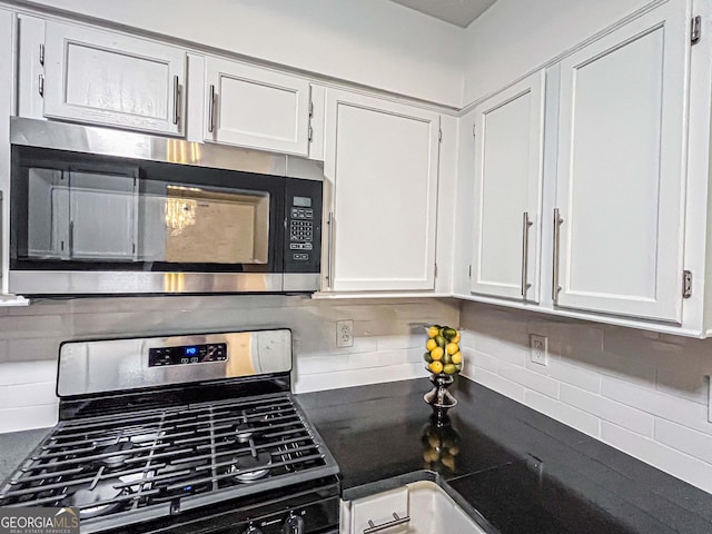 3150 Stratford Green Pl, Avondale Estates, GA 30002 - kitchen with stainless steel appliances, tasteful backsplash, white cabinets, and dark countertops