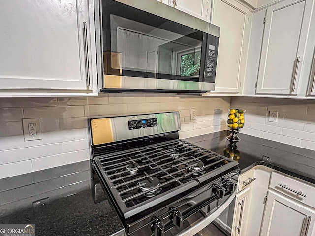 3150 Stratford Green Pl, Avondale Estates, GA 30002 - kitchen view of appliances with stainless steel finishes, decorative backsplash, white cabinets, and dark stone countertops