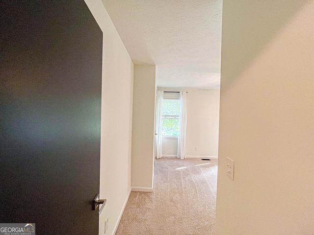 3150 Stratford Green Pl, Avondale Estates, GA 30002 - hallway with light carpet and a textured ceiling