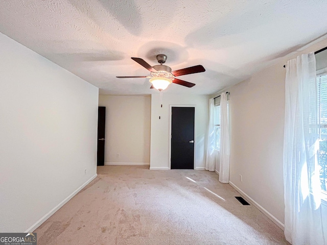 3150 Stratford Green Pl, Avondale Estates, GA 30002 - empty room with light colored carpet and a ceiling fan