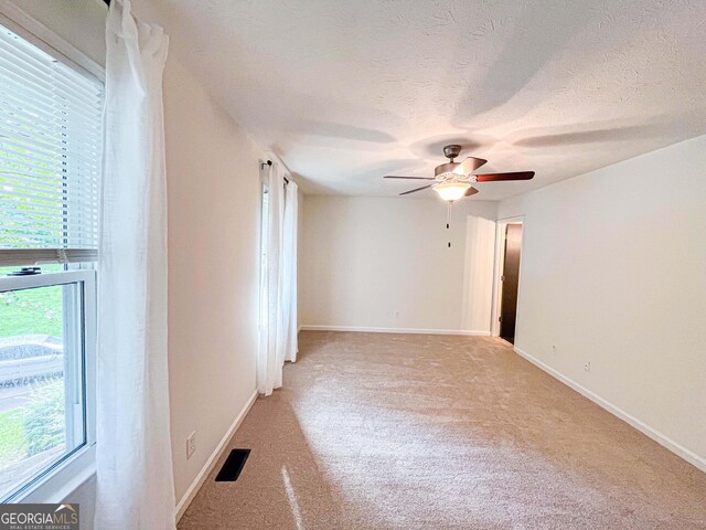 3150 Stratford Green Pl, Avondale Estates, GA 30002 - unfurnished room featuring light carpet, ceiling fan, and a textured ceiling