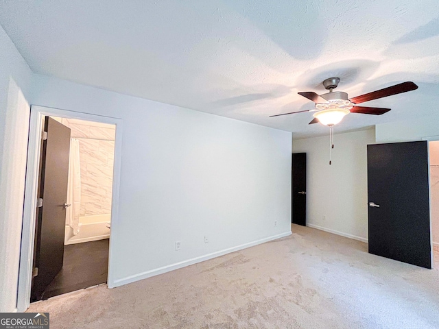 3150 Stratford Green Pl, Avondale Estates, GA 30002 - unfurnished bedroom featuring carpet floors, connected bathroom, and ceiling fan