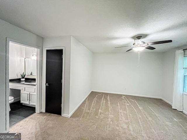 3150 Stratford Green Pl, Avondale Estates, GA 30002 - unfurnished bedroom featuring carpet flooring, ensuite bath, and a textured ceiling