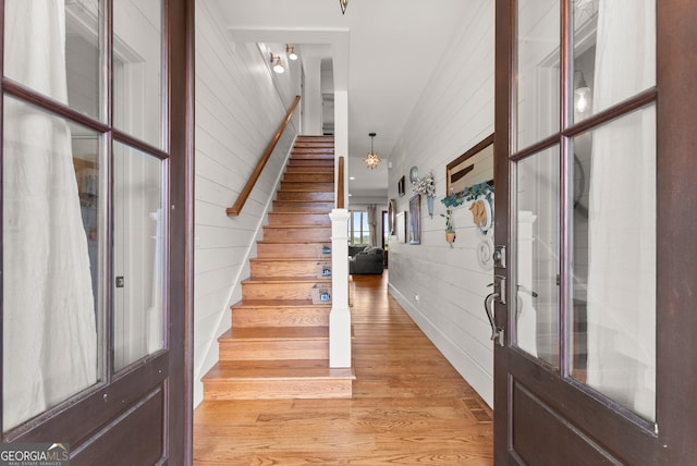 429 Hubert Harris Rd, Cornelia, GA 30531 - foyer entrance with wooden walls, stairway, and light wood-style floors