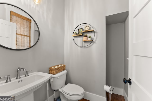 429 Hubert Harris Rd, Cornelia, GA 30531 - bathroom featuring a sink and wood finished floors