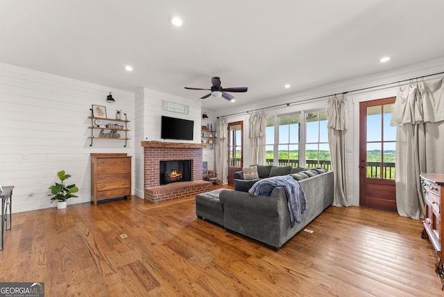 429 Hubert Harris Rd, Cornelia, GA 30531 - living area featuring a ceiling fan, light wood-type flooring, a brick fireplace, and recessed lighting