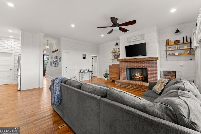 429 Hubert Harris Rd, Cornelia, GA 30531 - living room with ceiling fan, a fireplace, light wood-type flooring, and recessed lighting