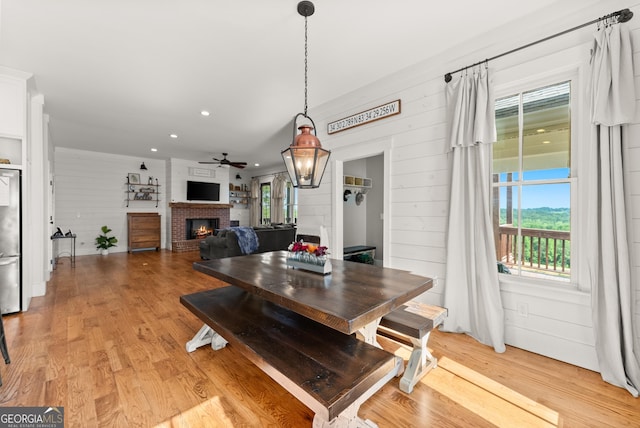 429 Hubert Harris Rd, Cornelia, GA 30531 - dining space with ceiling fan, a fireplace, light wood-type flooring, and recessed lighting