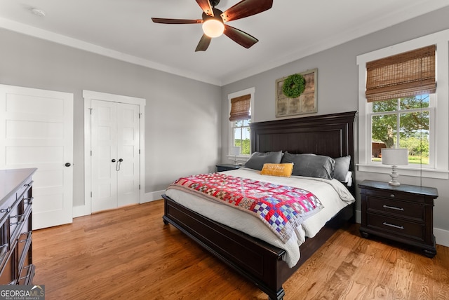 429 Hubert Harris Rd, Cornelia, GA 30531 - bedroom with light wood finished floors, a ceiling fan, and a closet