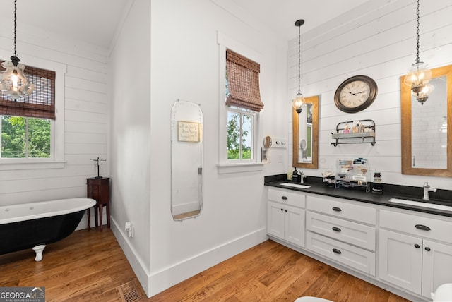 429 Hubert Harris Rd, Cornelia, GA 30531 - full bath featuring wood walls, double vanity, plenty of natural light, and wood finished floors