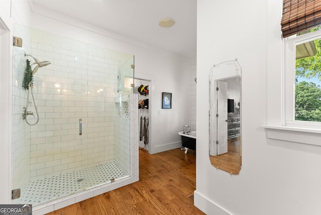 429 Hubert Harris Rd, Cornelia, GA 30531 - bathroom featuring a stall shower, wood finished floors, and a freestanding bath