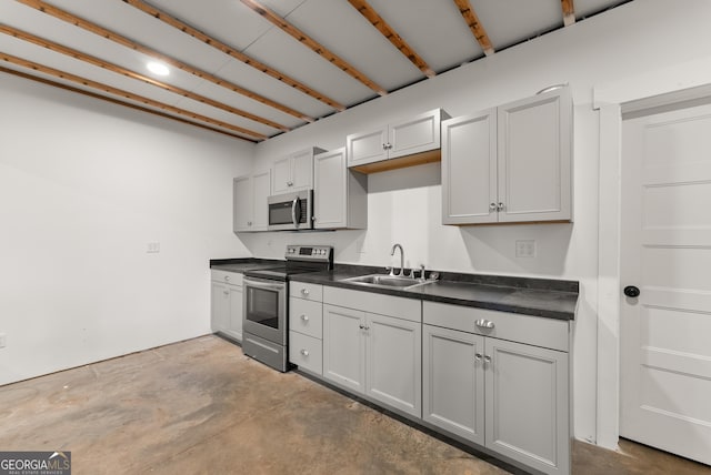 429 Hubert Harris Rd, Cornelia, GA 30531 - kitchen featuring appliances with stainless steel finishes, dark countertops, and concrete flooring