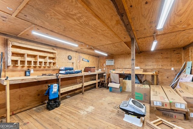 429 Hubert Harris Rd, Cornelia, GA 30531 - misc room with a workshop area, hardwood / wood-style floors, a wall mounted AC, and wood walls
