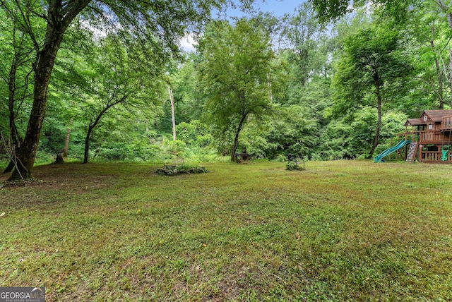 429 Hubert Harris Rd, Cornelia, GA 30531 - view of green lawn featuring a playground and a view of trees