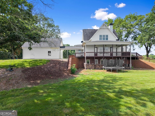 429 Hubert Harris Rd, Cornelia, GA 30531 - back of house featuring a trampoline, a yard, and a chimney