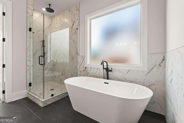 6750 Pannell Rd, Buford, GA 30518 - bathroom with tile walls, a marble finish shower, a soaking tub, and tile patterned flooring