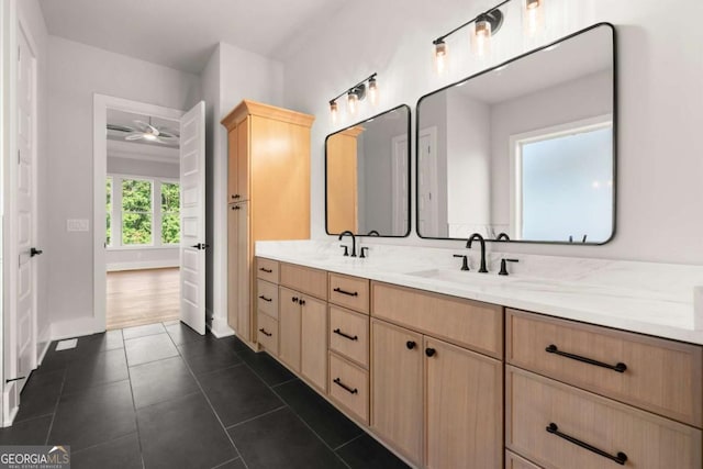 6750 Pannell Rd, Buford, GA 30518 - full bathroom featuring double vanity, tile patterned flooring, and a ceiling fan