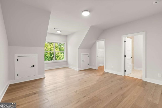 6750 Pannell Rd, Buford, GA 30518 - bonus room with light wood-style floors and lofted ceiling
