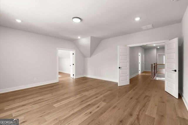 6750 Pannell Rd, Buford, GA 30518 - bonus room featuring light wood finished floors, recessed lighting, and lofted ceiling