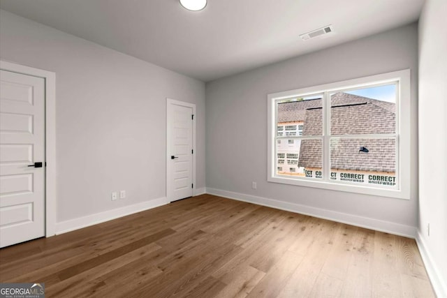 6750 Pannell Rd, Buford, GA 30518 - spare room with wood finished floors and baseboards