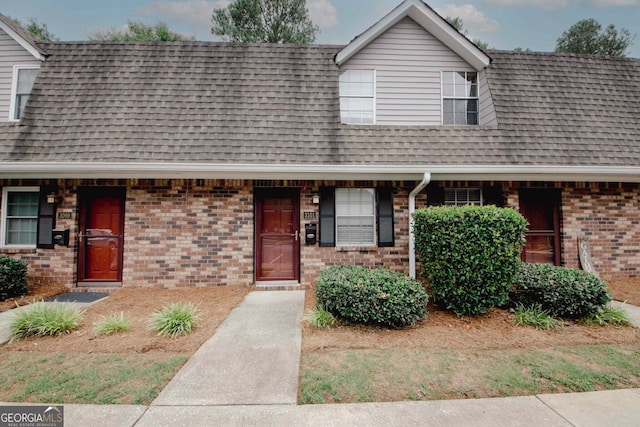3101 Reeves St SE, Smyrna, GA 30080 - view of property featuring brick siding and a shingled roof