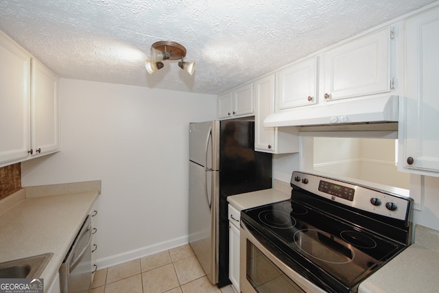 3101 Reeves St SE, Smyrna, GA 30080 - kitchen with stainless steel appliances, under cabinet range hood, white cabinetry, light countertops, and light tile patterned flooring