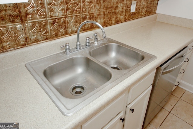 3101 Reeves St SE, Smyrna, GA 30080 - kitchen view of stainless steel dishwasher, white cabinets, and light countertops